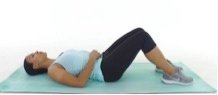 woman lying down and doing deep breathing