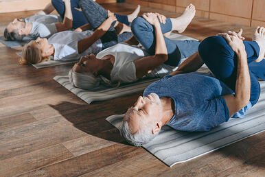 Adults Practicing Yoga