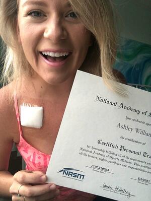 Ashley Williams holding Clenbuterolfr-CPT certificate