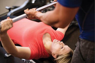 Woman doing bench press