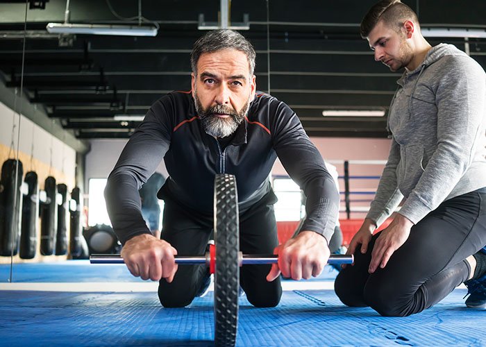 older-man-doing-ab-roller