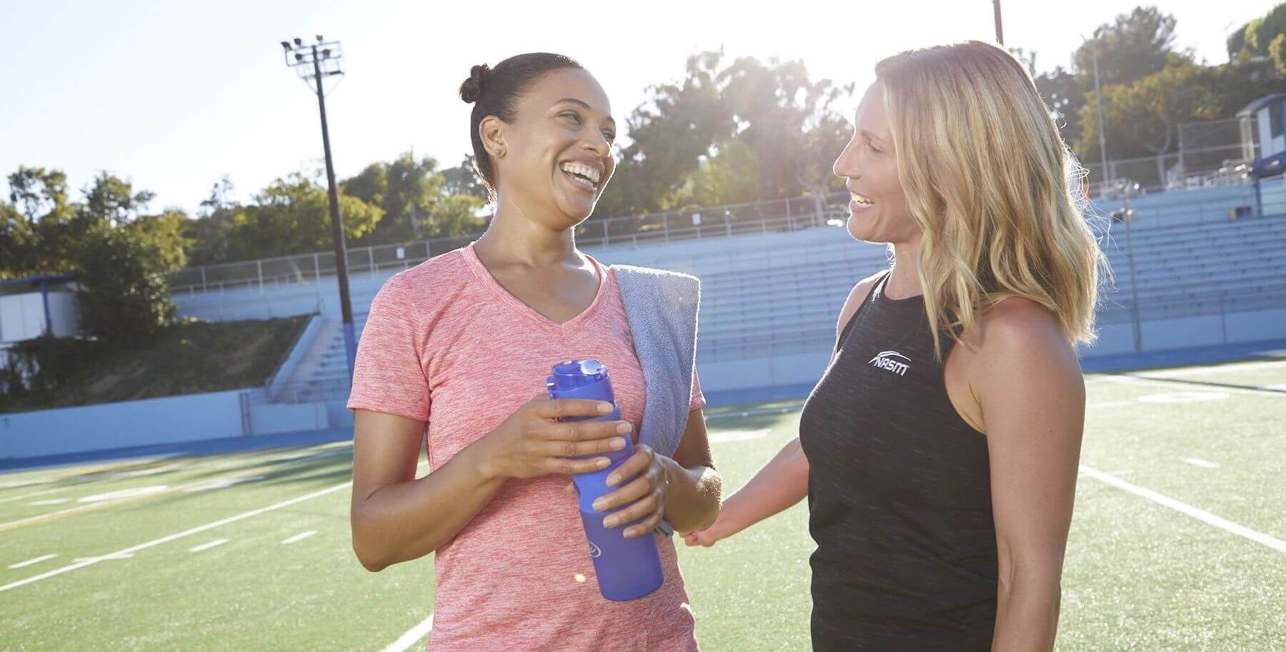 Personal trainer speaking to client 