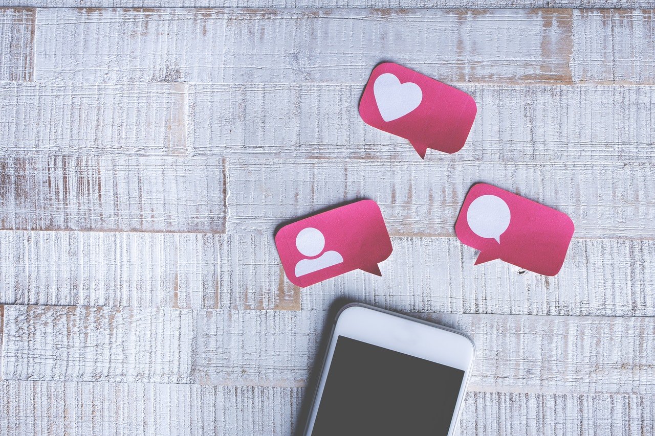 Social media icons above phone