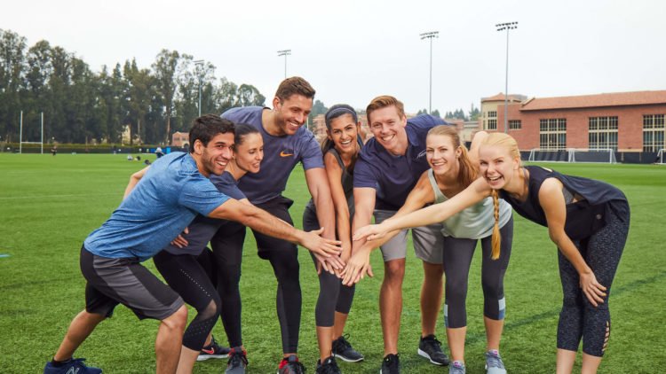 group fitness class all smiling together