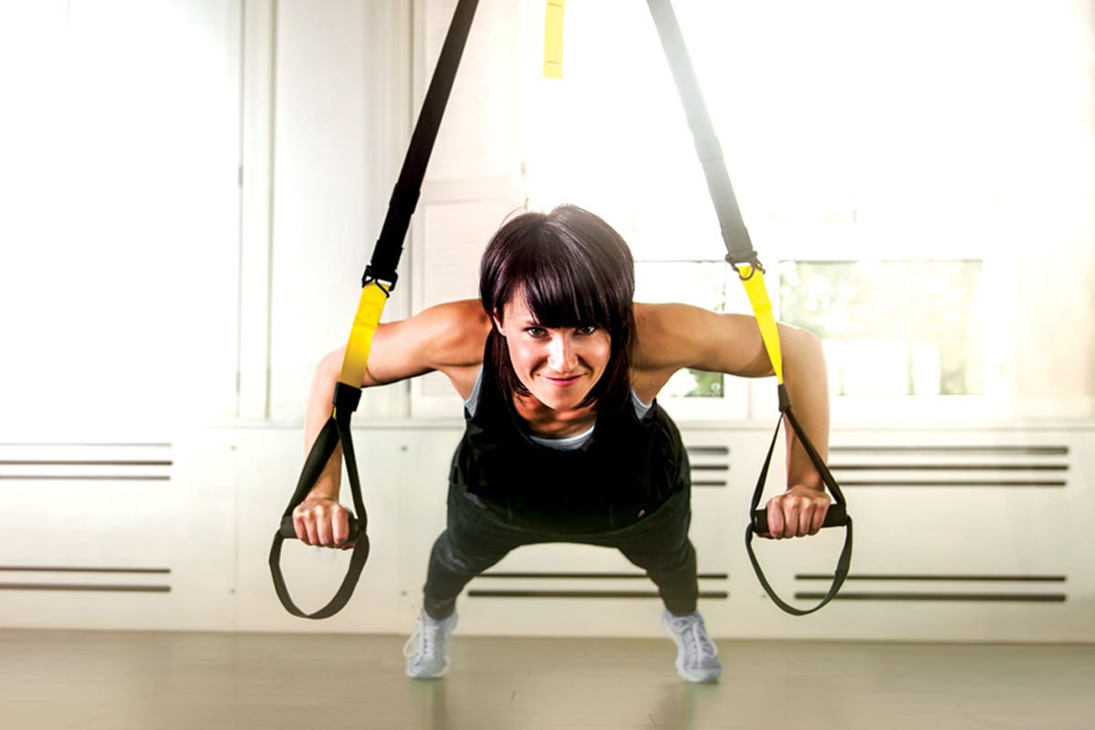 Woman using TRX