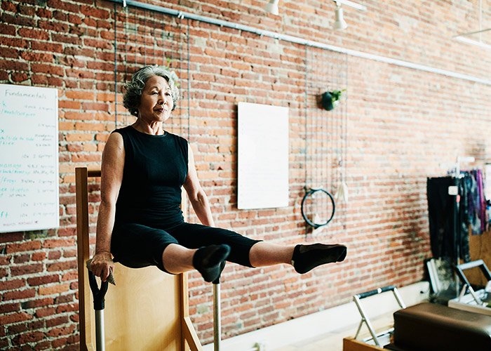 older woman doing a v-sit