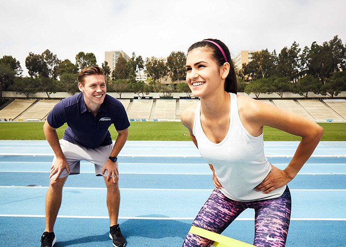 corrective exercise professional assessing client